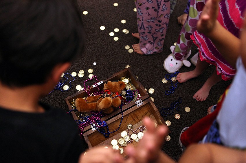 Coins and beads were found inside the treasure chest during the Indiana Jones treasure hunt that happened during Phillippi Shoresâ€™ storybook and PJ night, Thursday, April 26, in the library.