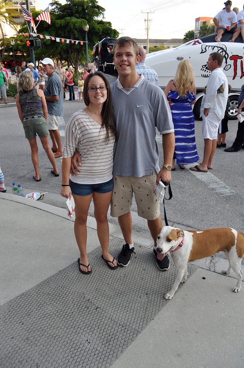 Kayla Lamb and Miles Mandango with Lilly the dog.