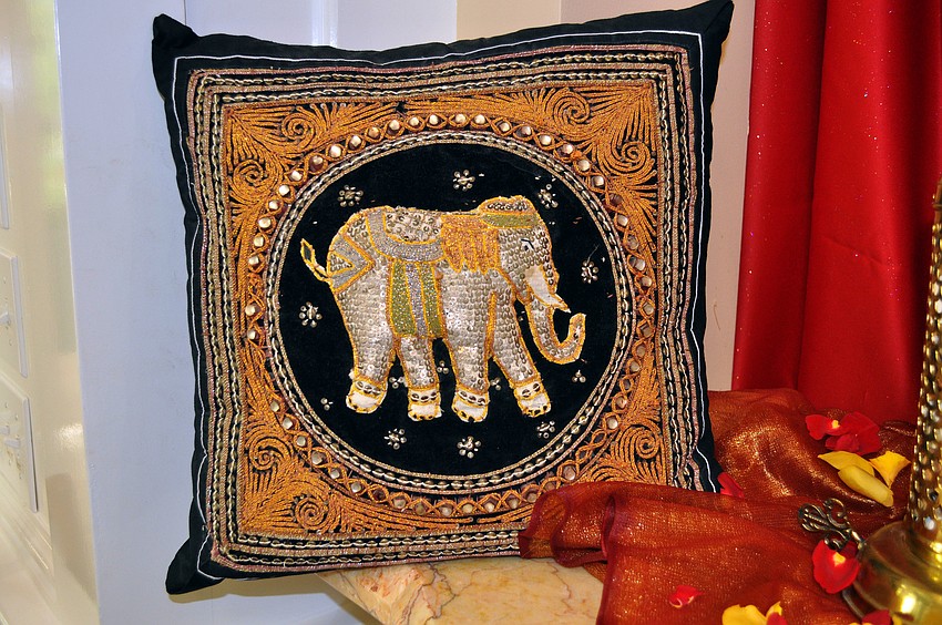 A pillow owned by Kathleen Powell that she bought in Thailand 10-years-ago was on display, Saturday, July 21, at Bird Key Yacht Clubâ€™s Passage to India night.