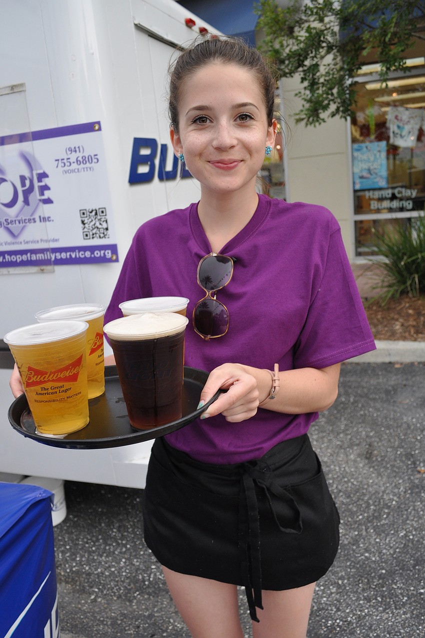 Hattie Gibson served beer on behalf of HOPE Family Services to guests in the