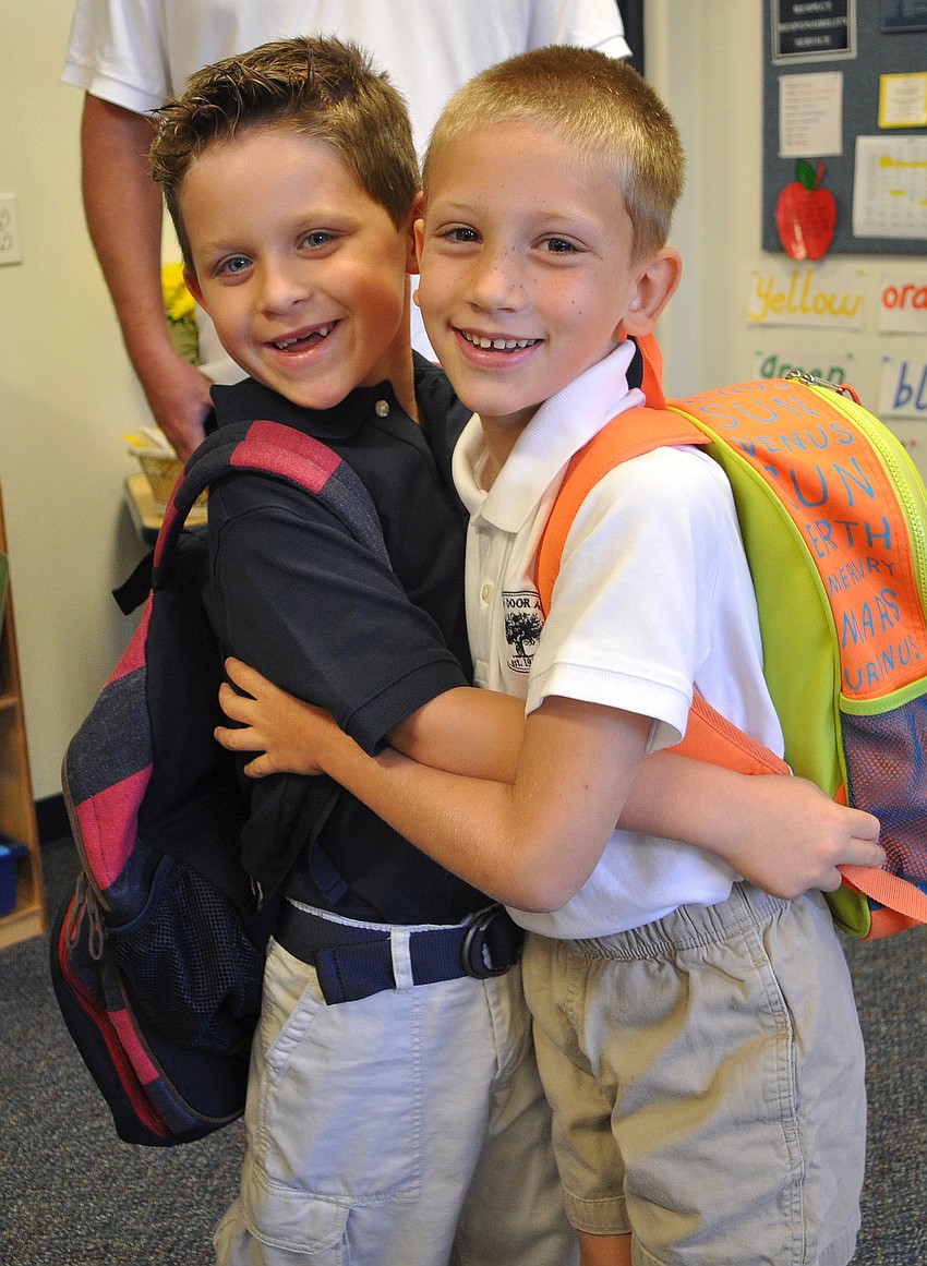 Zachary Szabo and Ryan Abernathy, 6, were happy to be reunited on the first day of school at Out-of-Door Academy.