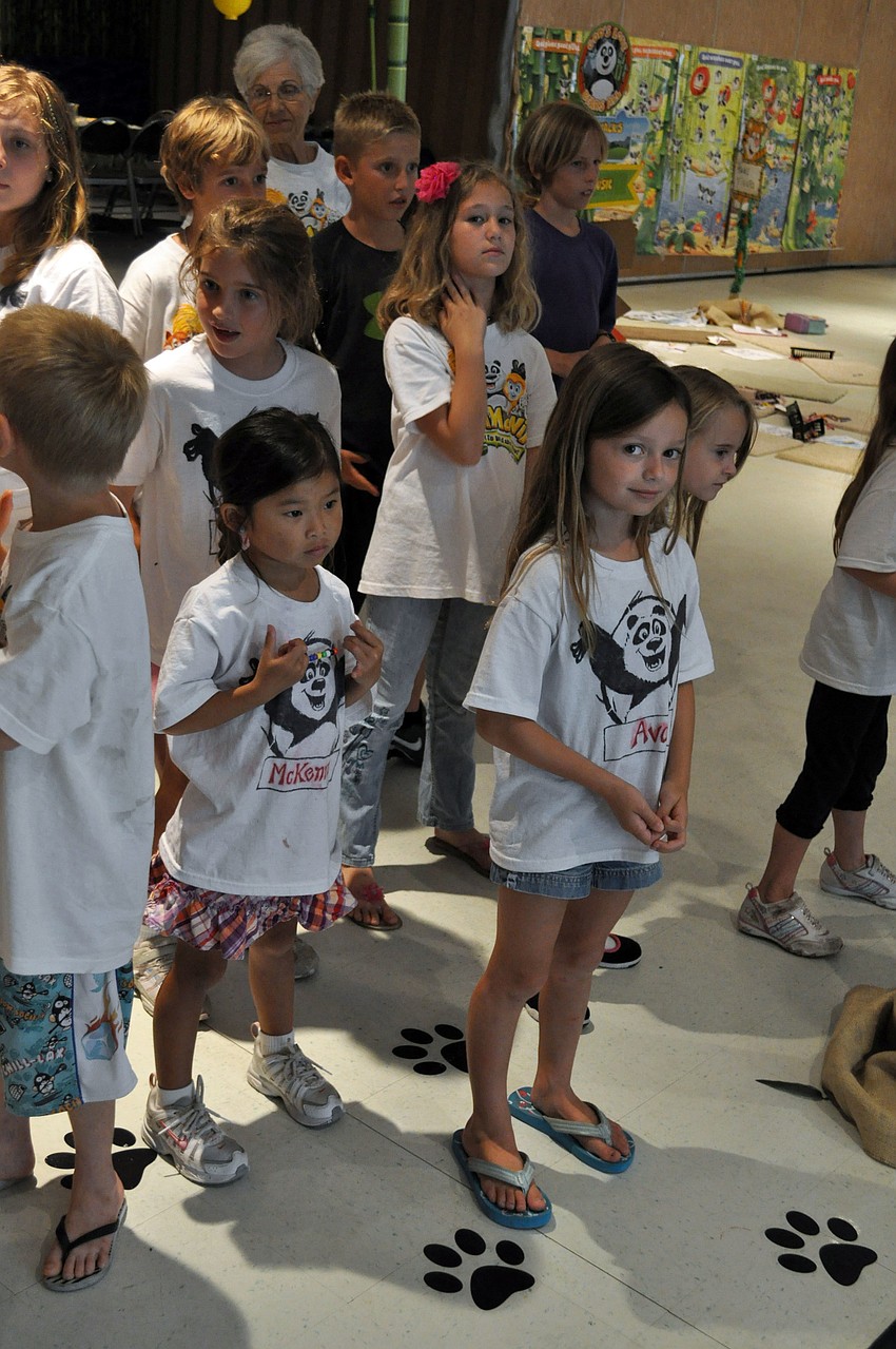 Children sang along to worship videos.
