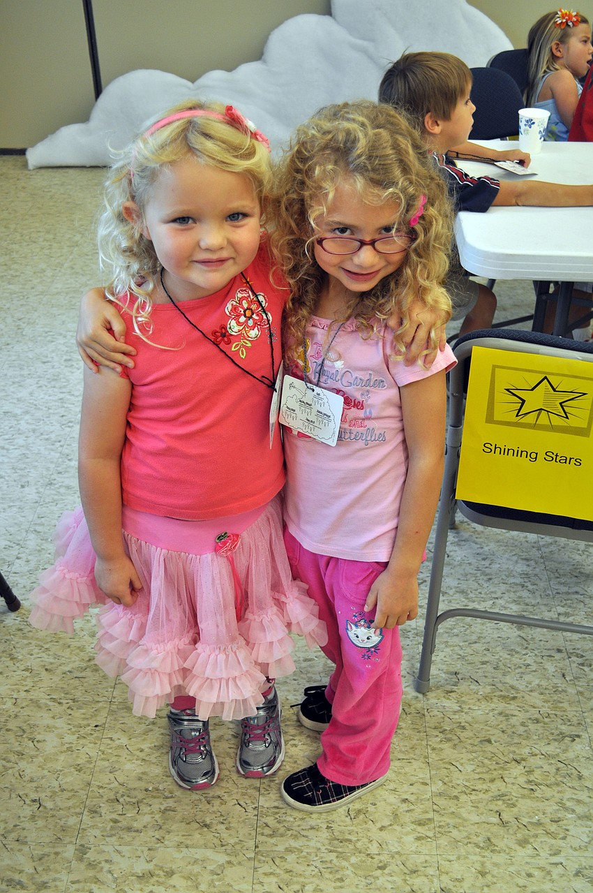 Students Zoey and Emma pose after snacks.