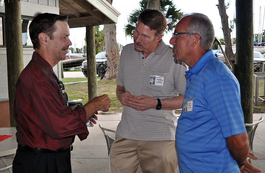 Carll Smith, Geoffrey Stewart and Jay Wilson catch up at the kickoff party for the Sarasota High School Class of â€™72 reunion.