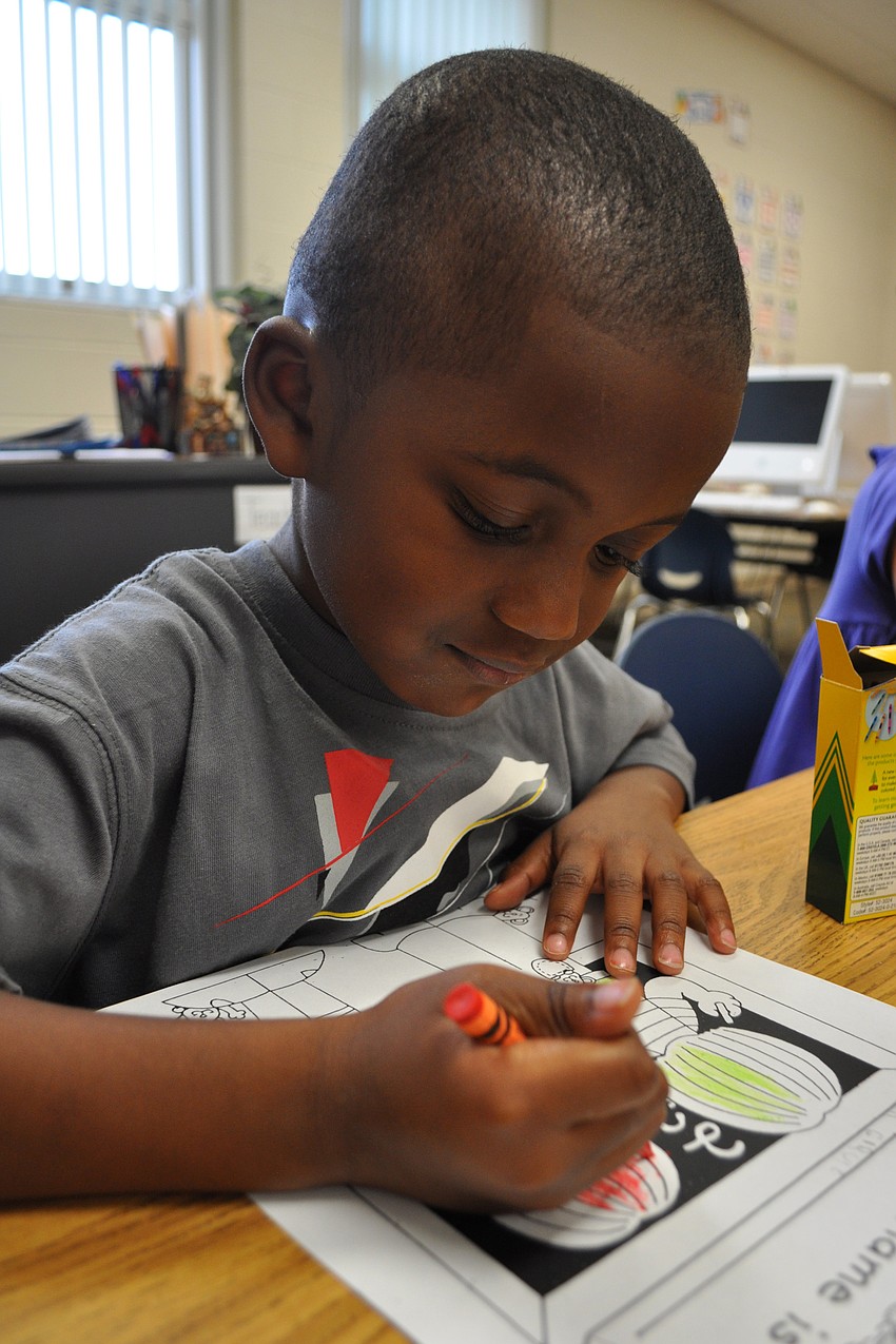 Almost as soon as school started, 4-year-old Garius Branch was busy coloring alongside his new classmates at Gullett.