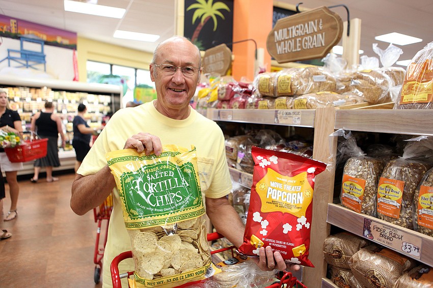 Duane Morin poses with two of his favorite Trader Joeâ€™s items Friday, Sept. 7. Morin, of North Port, has been a fan of Trader Joeâ€™s since 1974.