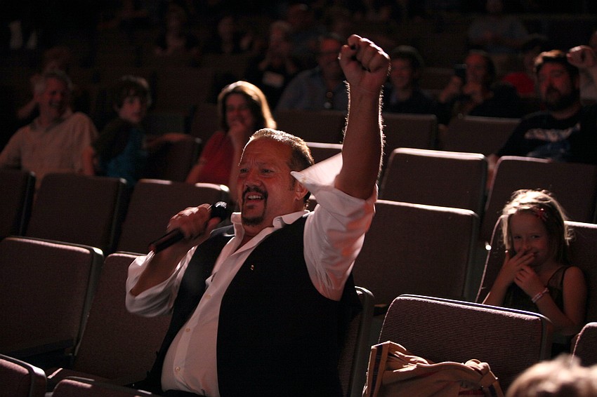 JJ Midnight rocks out from a seat in the auditorium.