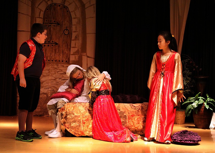 Hannah Sticht, Nurse, tries to comfort Ivy Morton, Juliet, while Carlton Leffler, Lord Capulet, and Bari Namgoong, Lady Capulet, scold Juliet for not obeying her parents wishes.