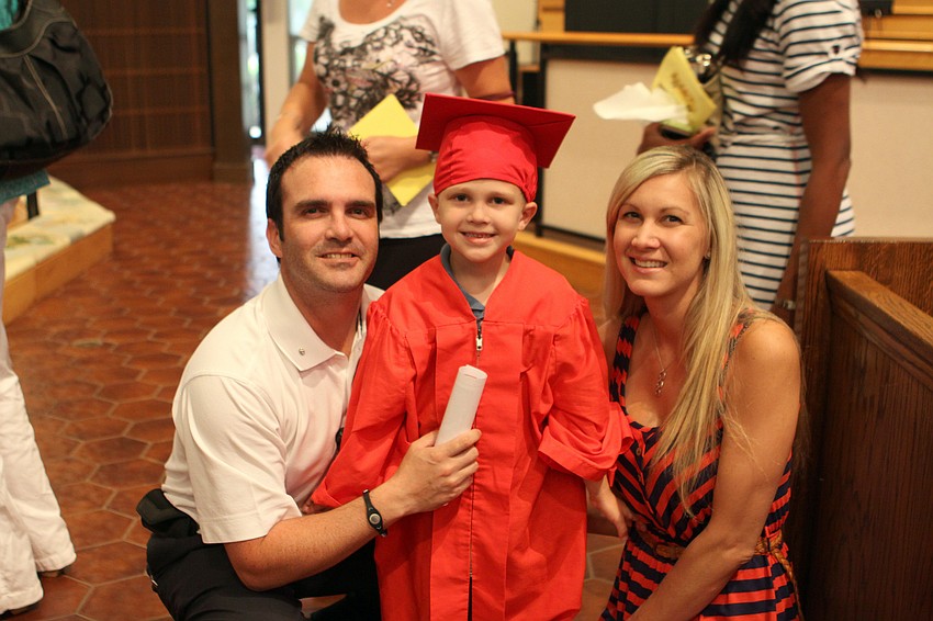 Aiden Oâ€™Callaghan, 5, with his parents, Gary and Jamie.