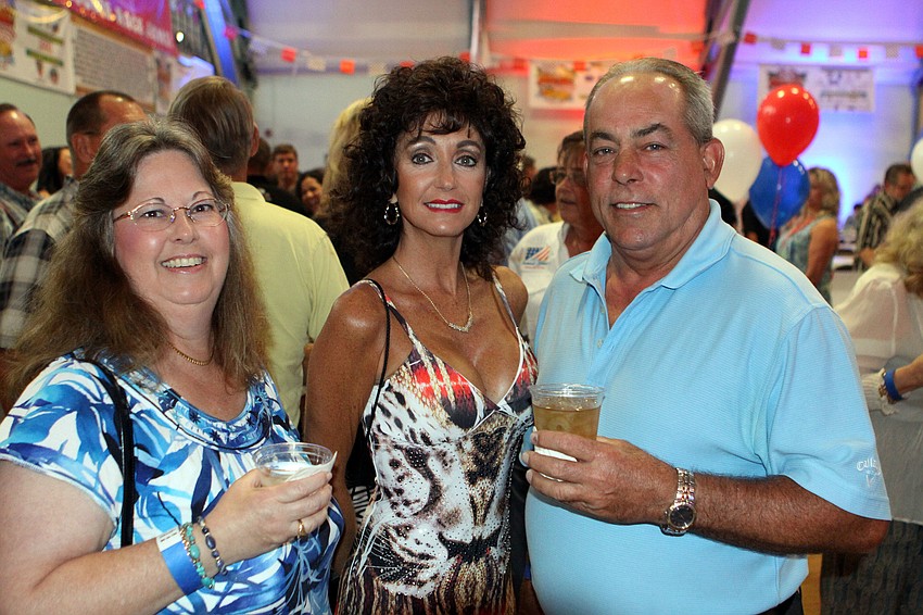 Vicki Jacobson, center, poses with Karen and Douglas McCaw