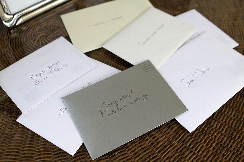 A collection of cards on the gift table at the wedding reception.