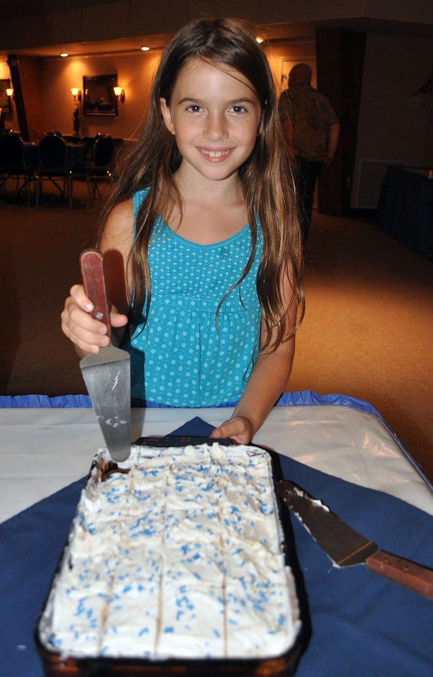 Eden Glickman, 8, made a vanilla cake for the La La La Havdalah event, Saturday, Aug. 18, at Temple Emanu-El.