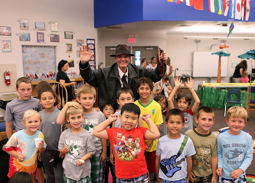 Michael â€œIndiana Jonesâ€ Gange poses with all the boys who attended Phillippi Shoresâ€™ PJ and book reading night, Thursday, April 26.