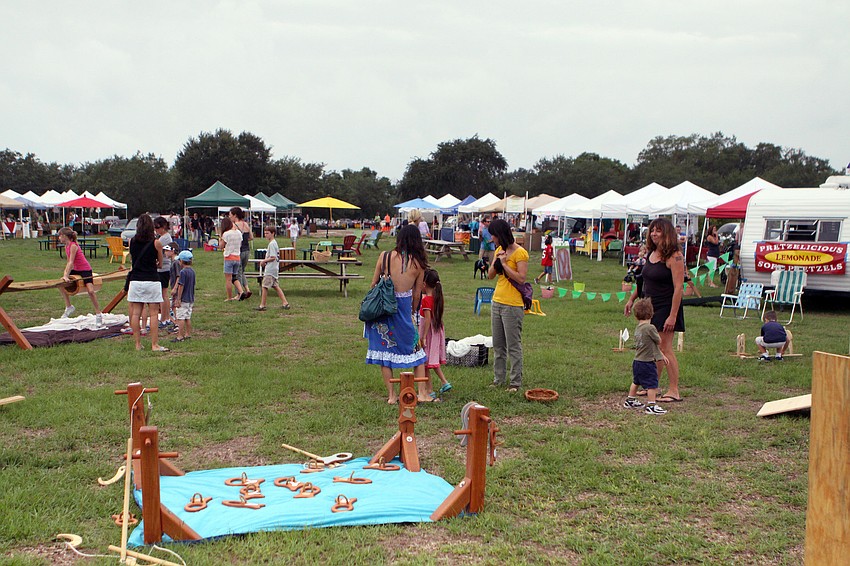 Parents and kids had fun playing games, wandering the market and listening to music, Wednesday, June 6, during Childrenâ€™s Day at the Phillippi Farmhouse Market.