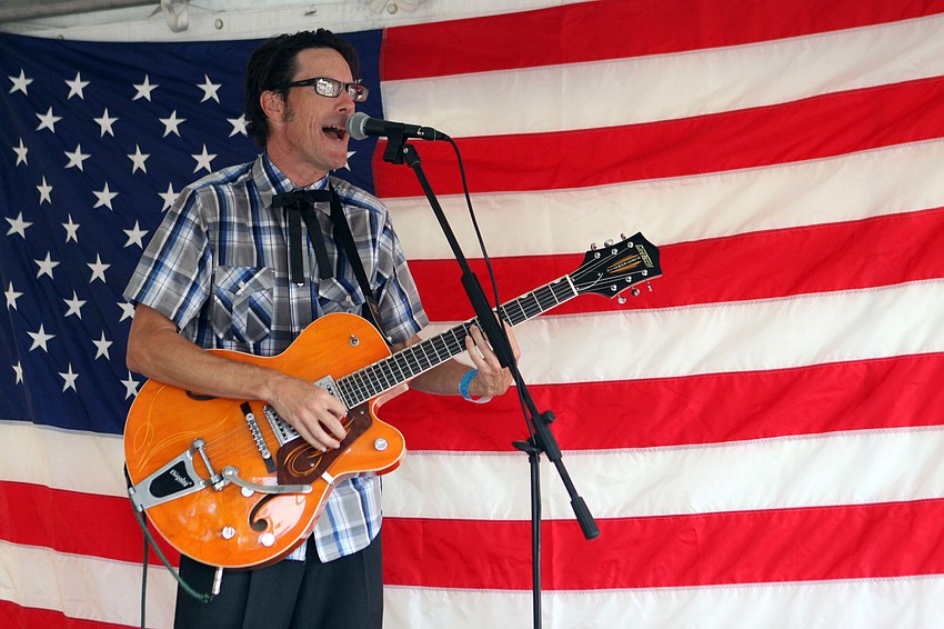 Ted Stevens rocks out with his band, Ted Stevens and the Doo-Shots, during the VIP Party, Wednesday, July 4, at Siesta Key Public Beach.