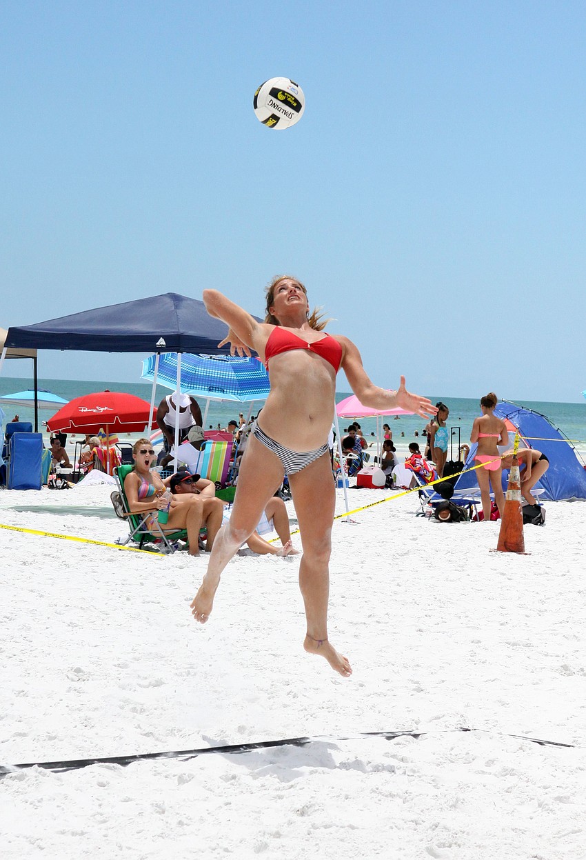 Aurora Newguard serves the ball.