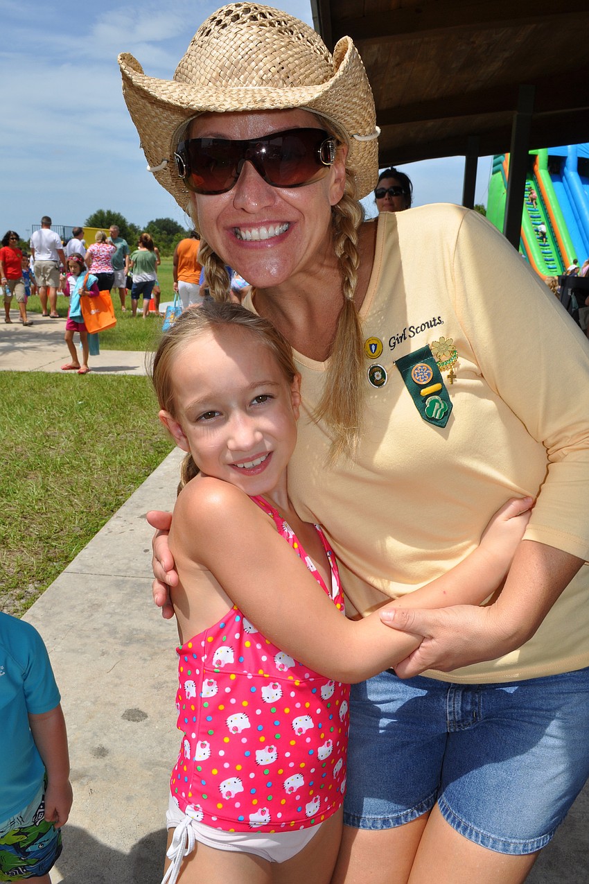 Megan and Stacie Workman eagerly wait to get a balloon creation.
