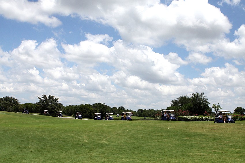 The golf carts headed off to their holes to begin the 13th Annual SKCC Golf Tournament, Monday, May 7, at the Ritz Carlton Members Club.