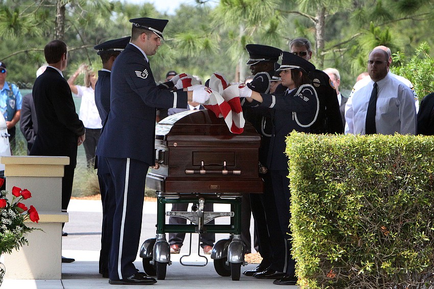 The flag that was placed on top of Chief Albert Hogleâ€™s casket is folded up.