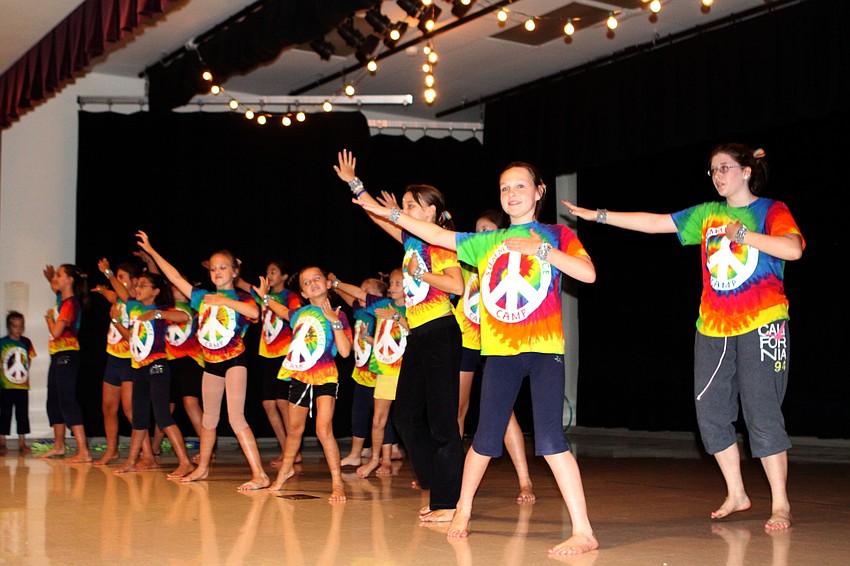 The girls dance to â€œDominoâ€.
