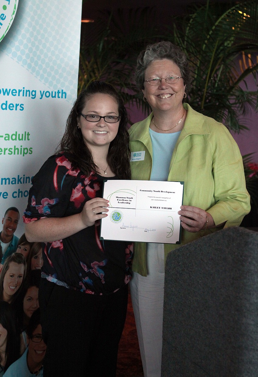 Kailey Taylor and Karen Bogues pose together after Taylor won the Shannon Staub Excellence in Leadership award.