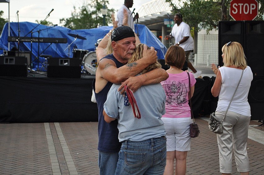 U.S. Air Force veteran David Whitney slow dances with Army veteran Kimberly Dickersin.