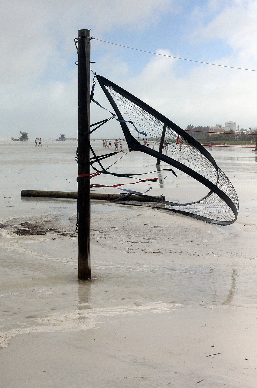 A volleyball net was destroyed overnight due to tropical storm Debby.