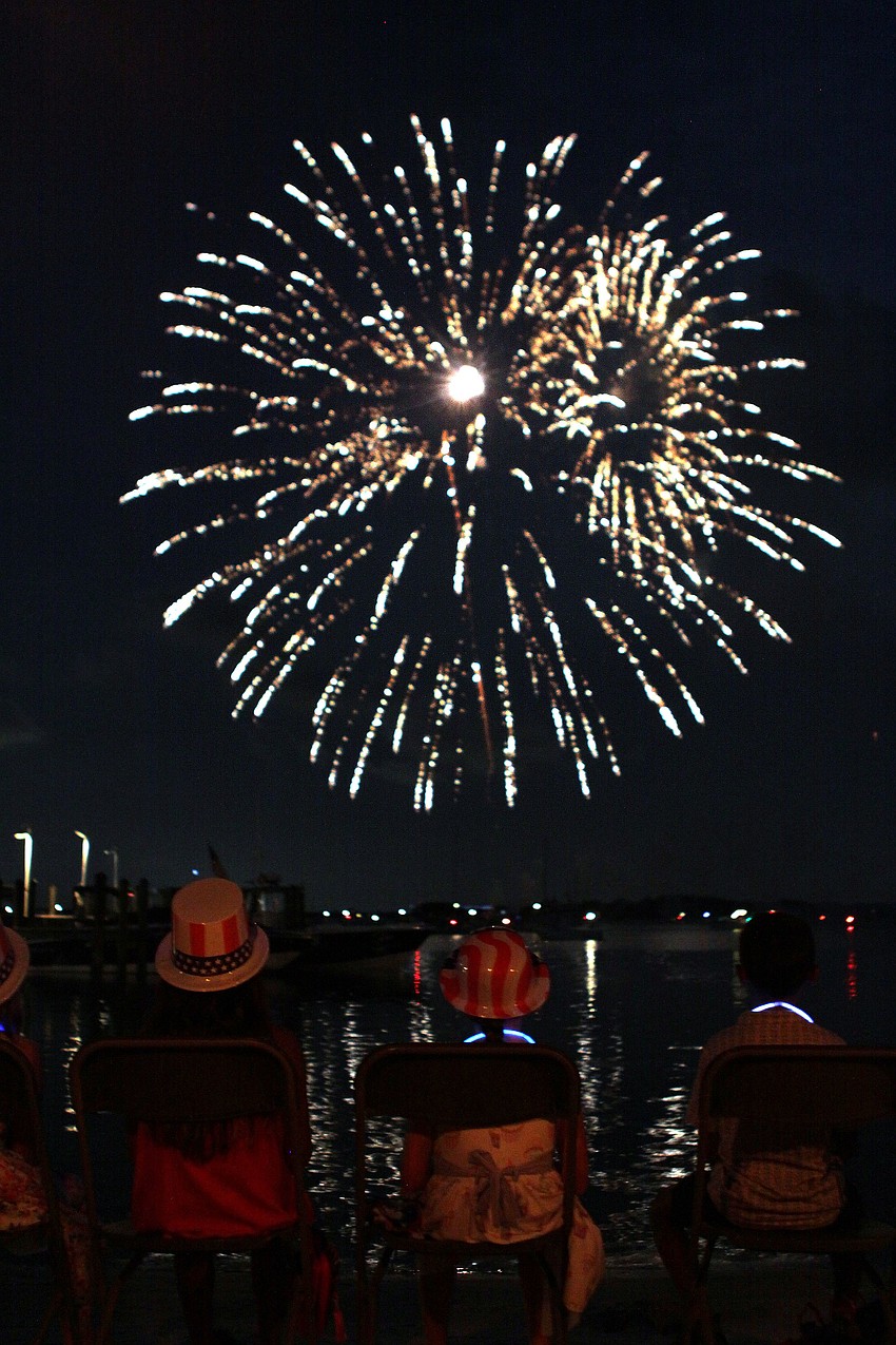 Children wore patriotic, plastic hats while sitting on the beach at Mar Vista, Monday, July 2, during the 4th annual Boom Boom on the Bay.