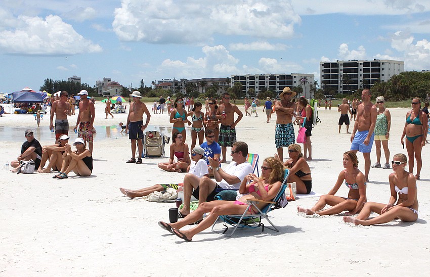 Volleyball enthusiasts, players and random beachgoers watched the matches from their towels and beach chairs on Saturday.