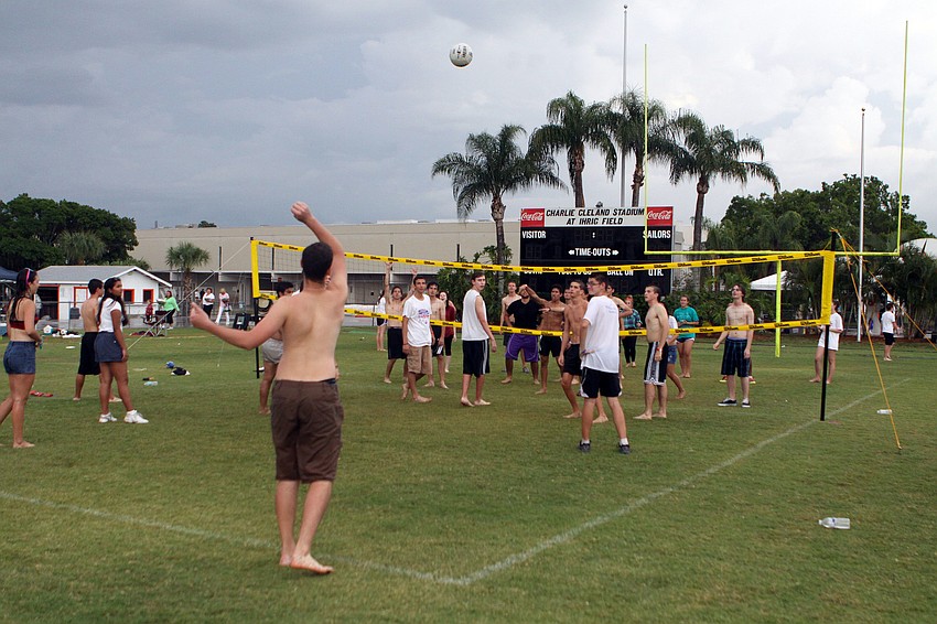Kids have fun playing volleyball after a rainstorm, Saturday, April 28, during Relay for Life on the Sarasota High School football field.