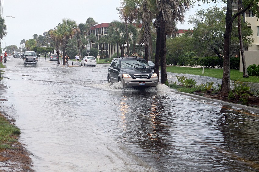A stretch of Beach Road that was underwater was still driven on by many cars and trucks Monday afternoon.