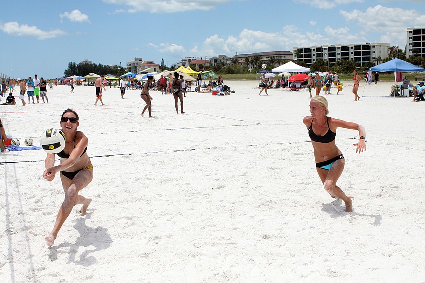 Kaley Read runs to hit the ball as Melissa Moore makes her way over to help her teammate out, Saturday, July 14.