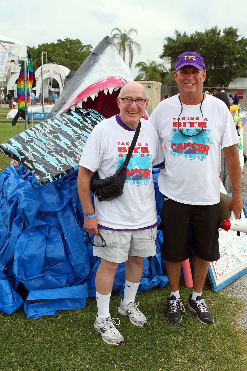 Paul Zatz and Mark Boyer pose with the shark Boyer created for the Zuper Zatz team, which was the top team raising $19,635.
