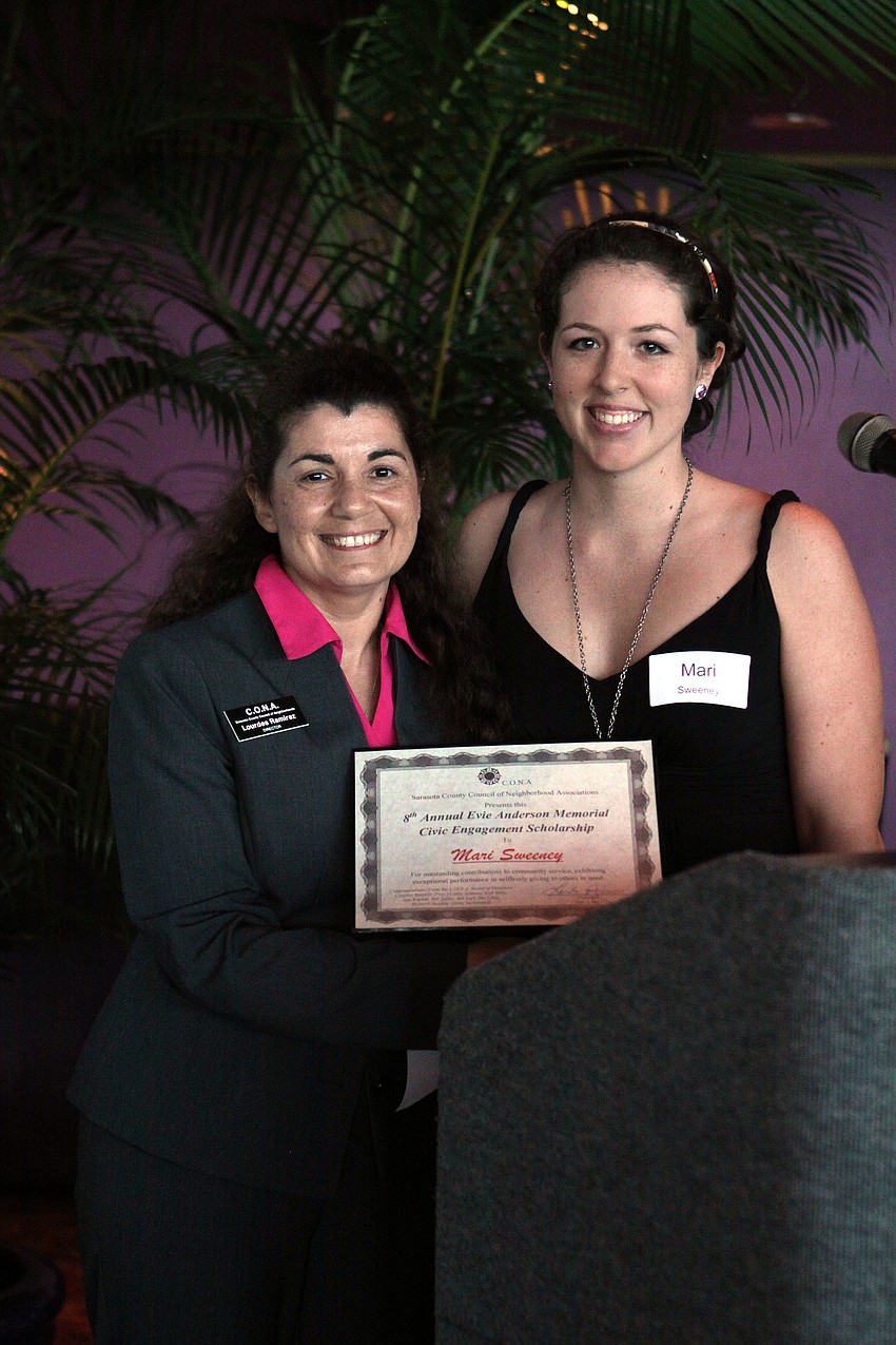 Lourdes Ramriez poses with Mari Sweeney after presenting her with the 8th Annual Evie Anderson Memorial Civic Engagement Scholarship.