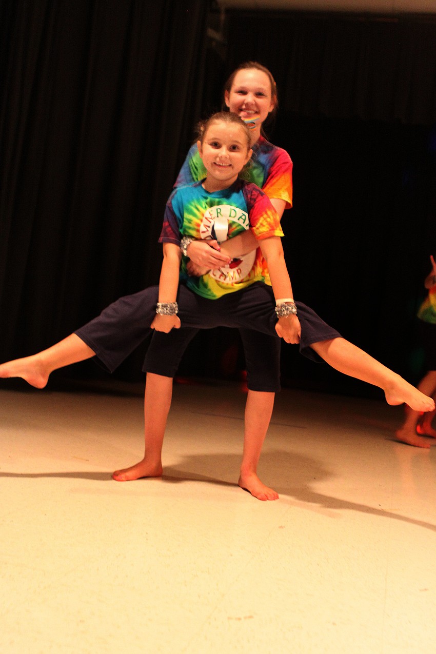 Emma Wadle and Hailey Simpson doing a lift split.