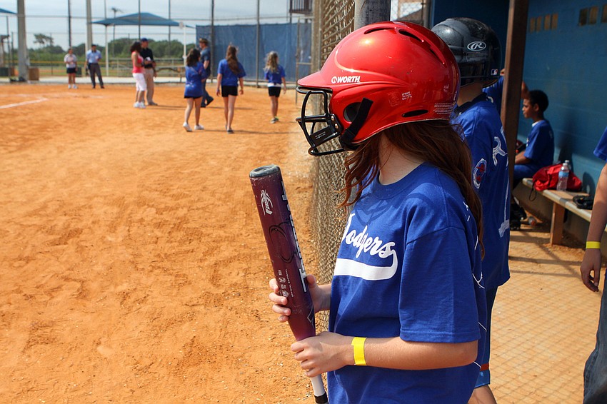 Emily Piaezisi waits for her turn at bat Friday, April 29 during the Ashton Elementary fifth grade World Series day at Twin Lakes.