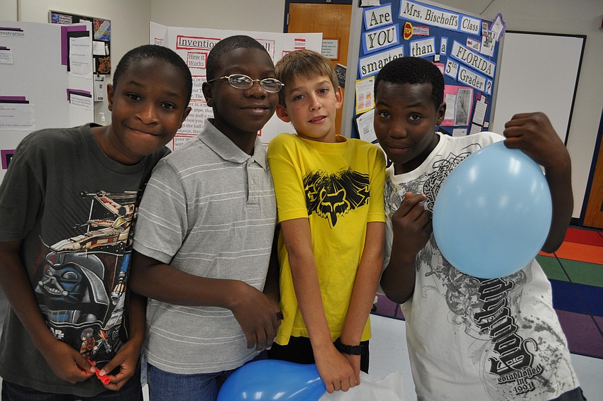 Israel Washington, Ishmael Nelson, Colton Walker and Jesse Joseph checked out the science exhibits.