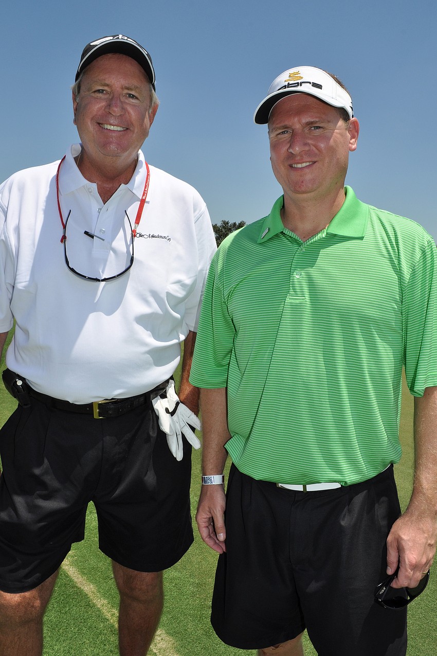 Warren Simonds, of Willis A. Smith Construction, with Brian Volner, of C1 Bank