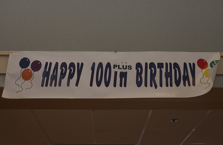 A sign that hung over the entry way to the bar read â€œHappy 100 Plus Birthdayâ€.