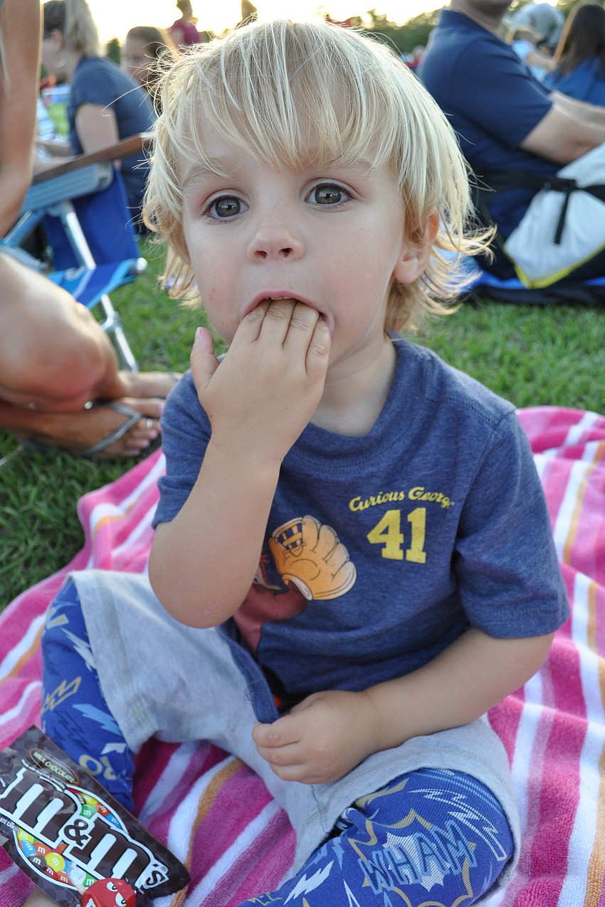Macklin Higgins, 2, feasted on M&Ms before the show even began.