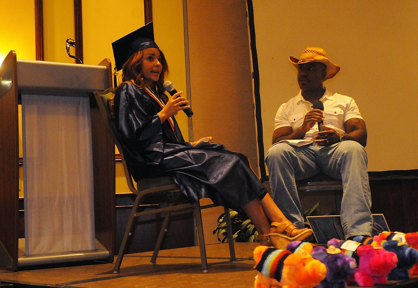 R.O.C.K. scholarship recipient Brenda Sorto, who was diagnosed with cancer when she was 2 years old, shares her story with Dr. Dwight Fitch of 21st Century Oncology and those in attendance after graduating from the State College of Florida.