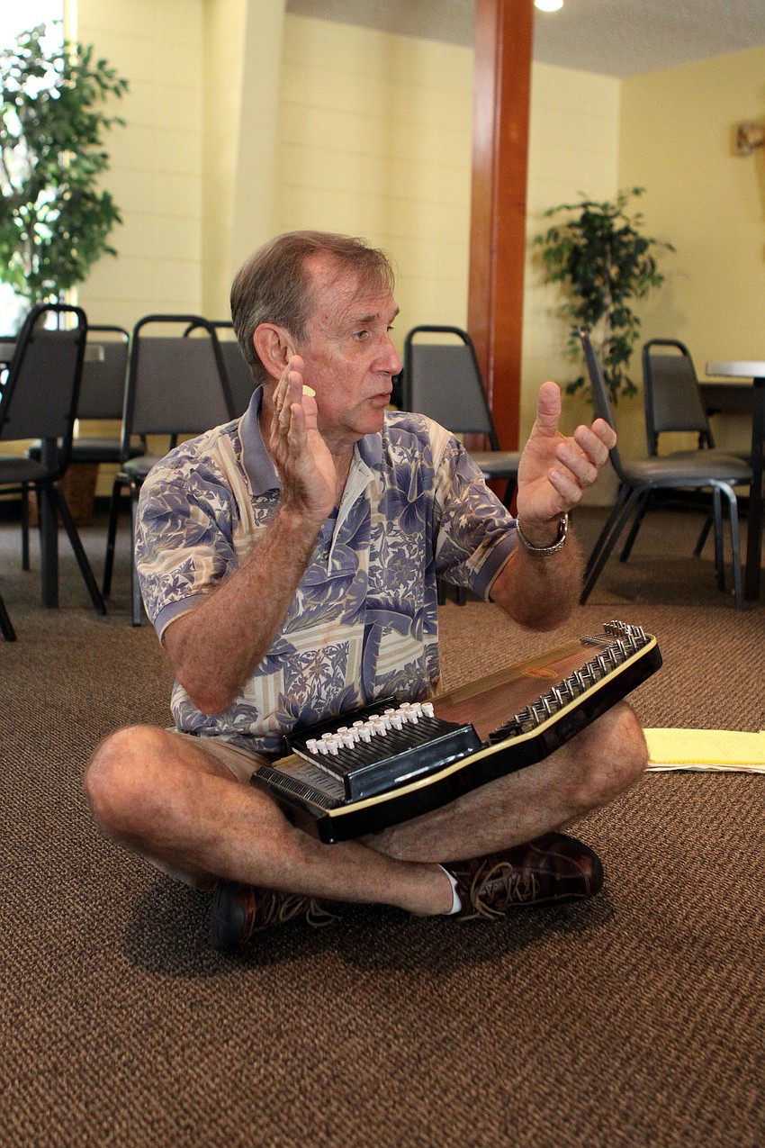 St. Bonifaceâ€™s Minister of Music Seth Wertz encourages the students to clap along with him.