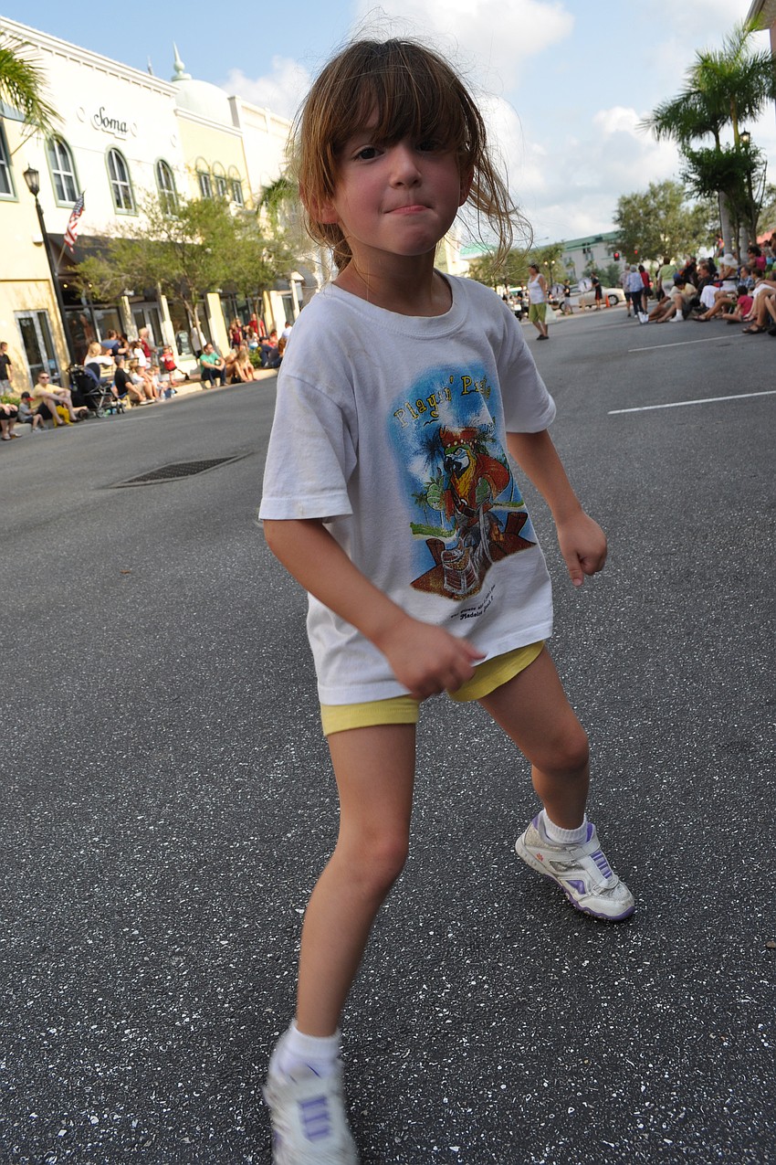 Madison Downes, 4, danced in the streets as the parade got started.