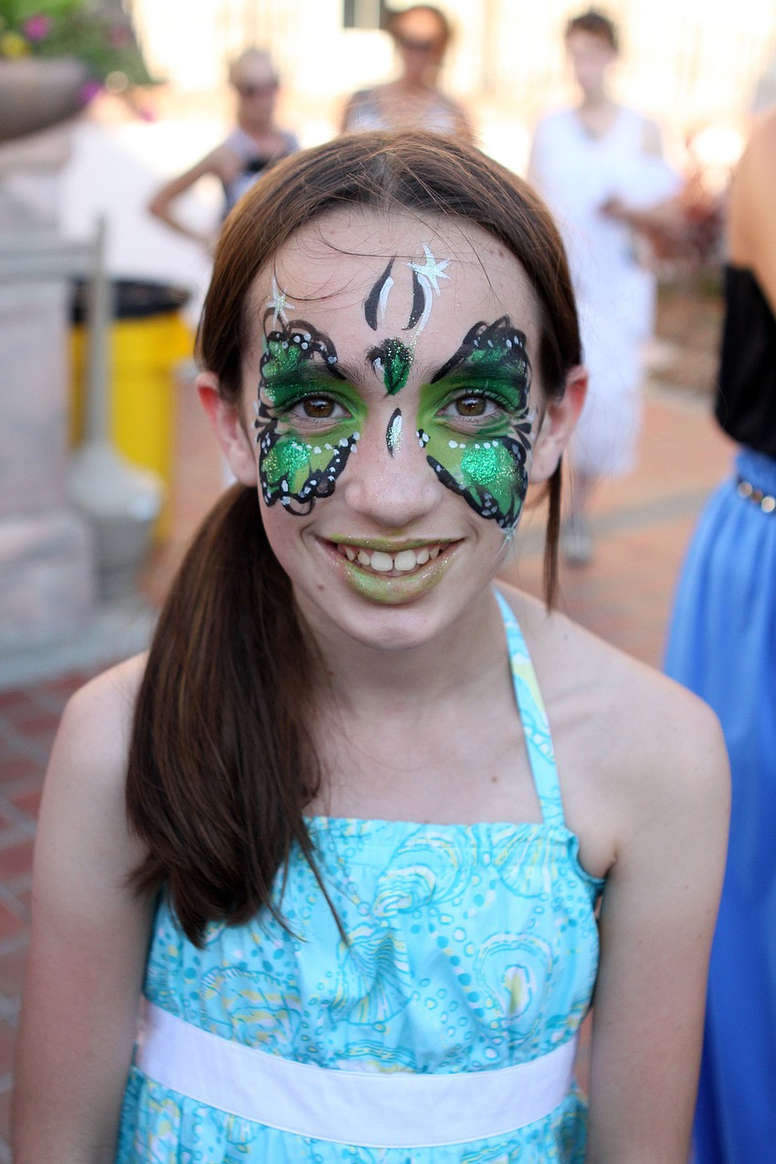 Taryn Appleby, 10, who attended graduation to see her brother, senior, Cody Gunton, had her face painted by senior, Crystal Miller.