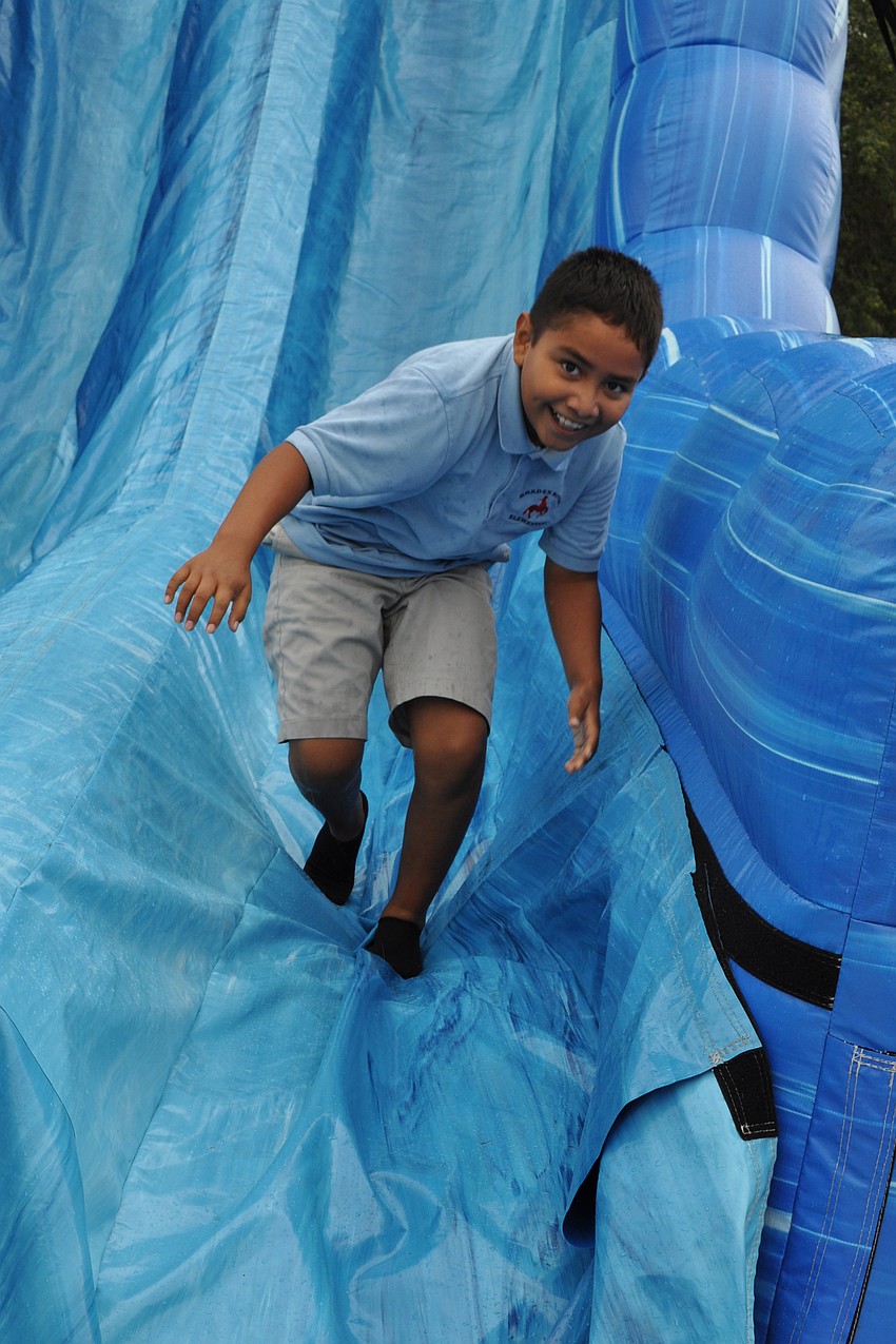 Jose Villa enjoyed the steep slope of the inflatable slide.