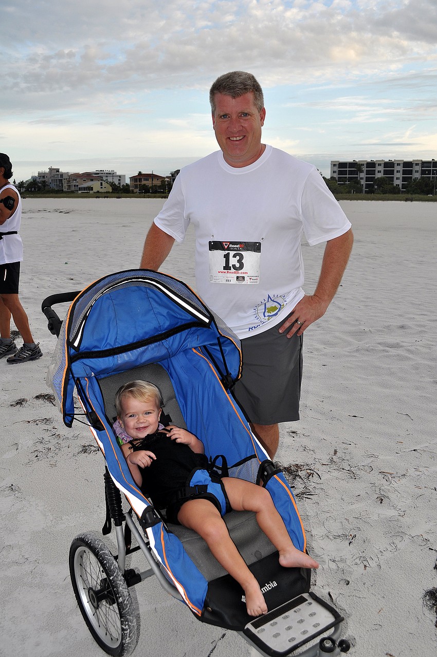 Justin Brown ran while wheeling Olivia, 1, in her stroller.