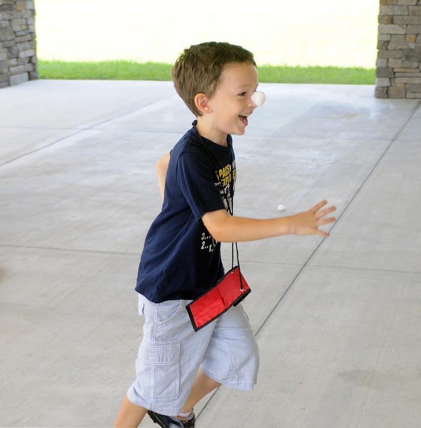 Five-year-old Reece Rizzo races back to his teammates.