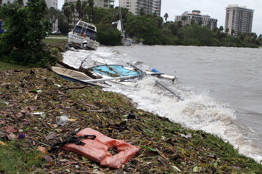 A lifeguard jacket and tons of debris came to shore, along with two boats, at Island Park.