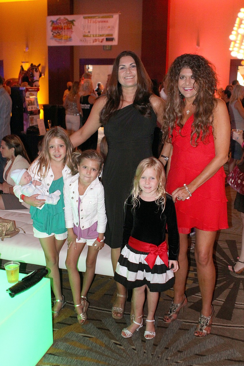 Martha Pandinel and Kimberly Cox with left to right, Isabella Cox, 8, Alancin Cox, 7, and Mya Iles, 5.