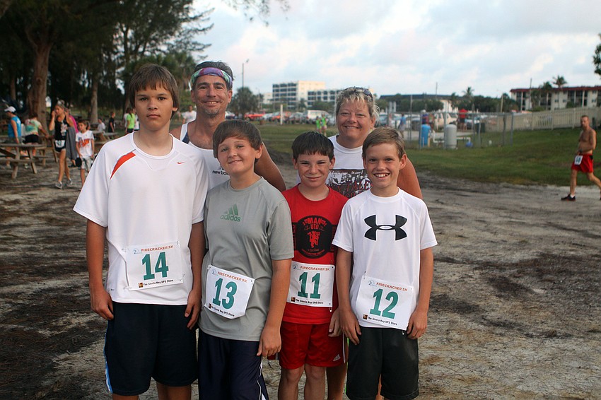Bob and Lori Sarocka with Jack Sarocka, 14, Paul Benes, 14, Sam Sarocka, 12, and Nick Guthrie, 12, participated in the Firecracker 5K while on vacation from Lombard, Ill.
